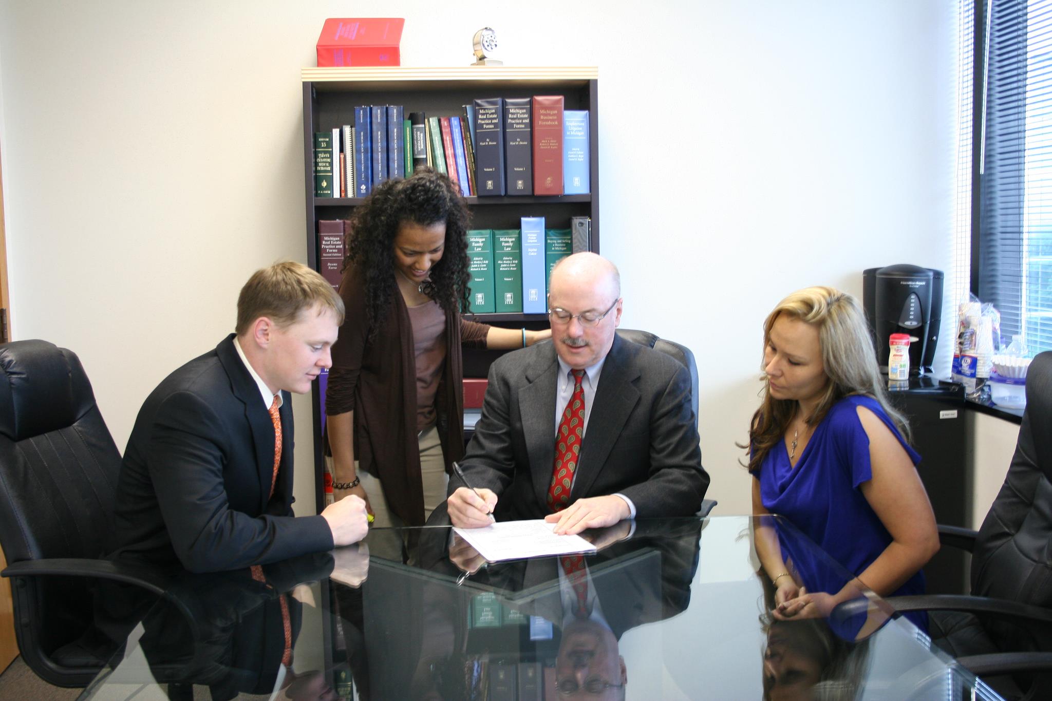 The Foley Law Team in a meeting